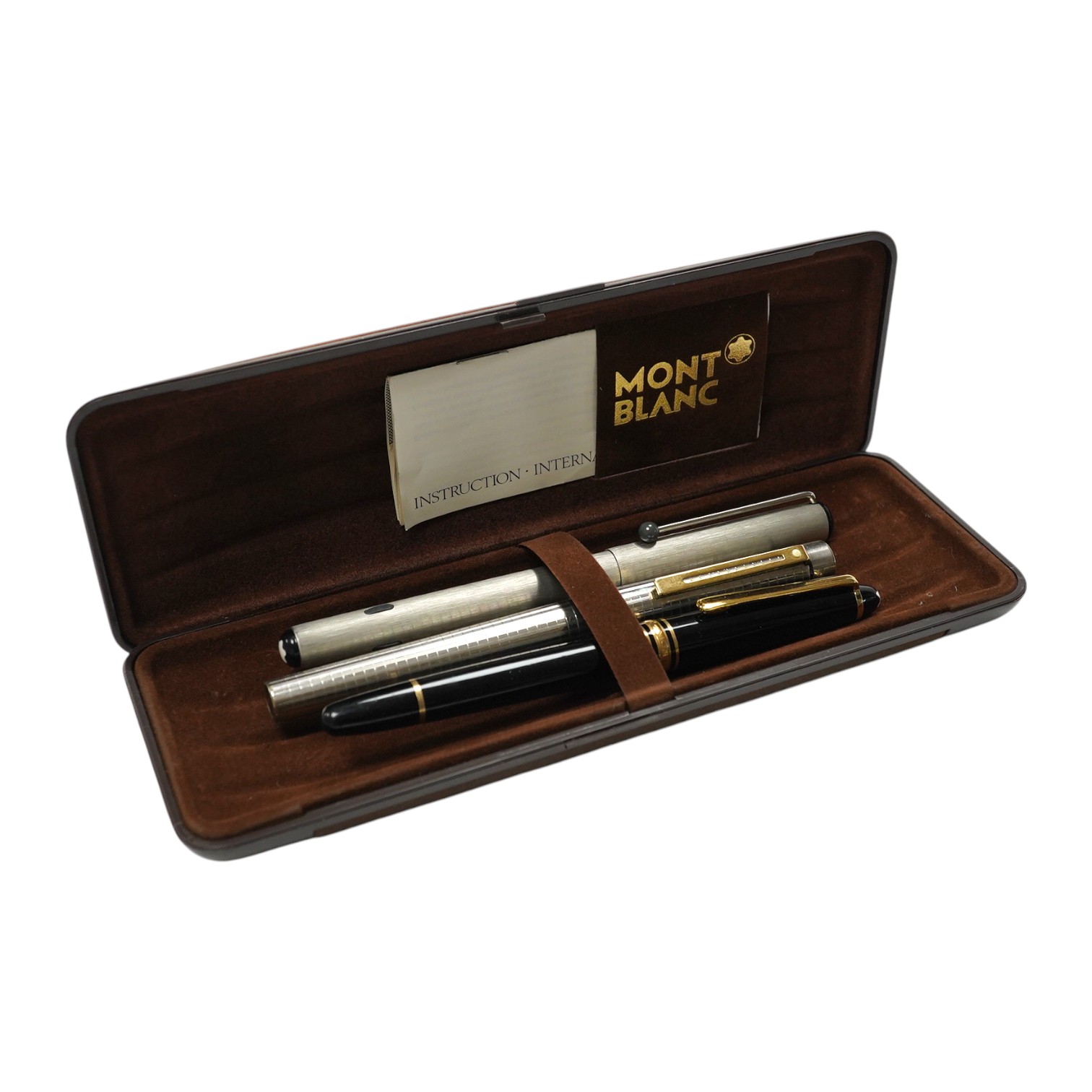 Two Montblanc fountain pens and a Sheaffer fountain pen, in a Montblanc case. Condition - fair to good